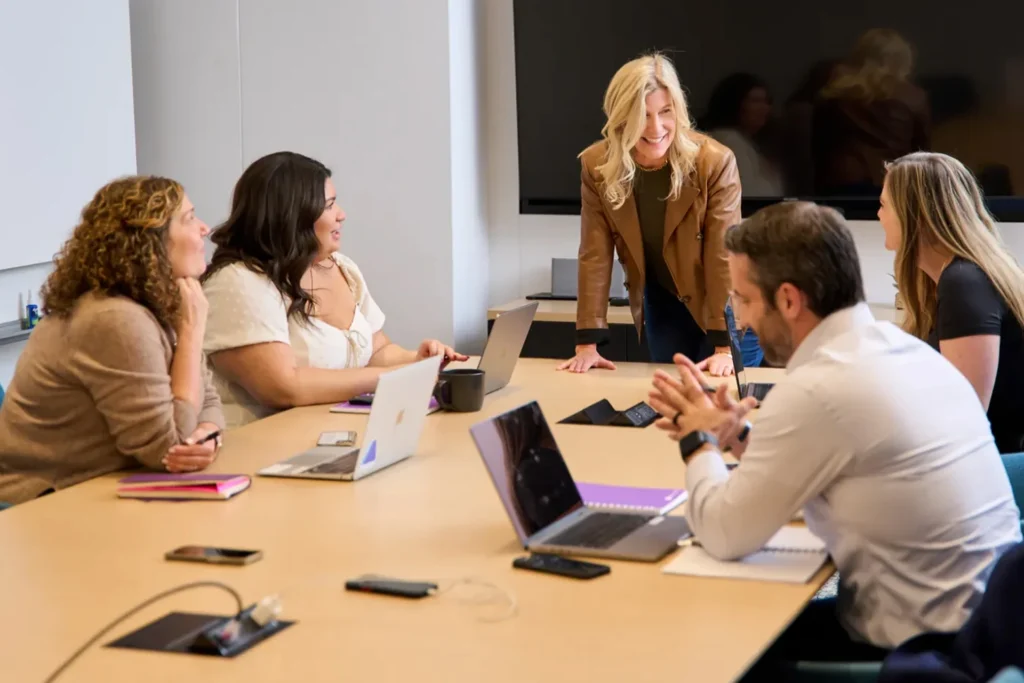 Virtualitics team members around an office table