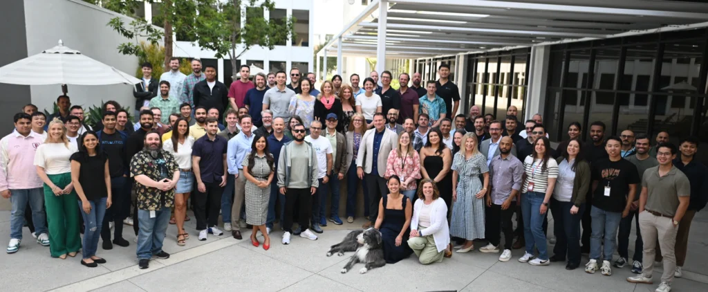 Large group shot of Virtualitics employees outside in front of the Virtualitics office in California