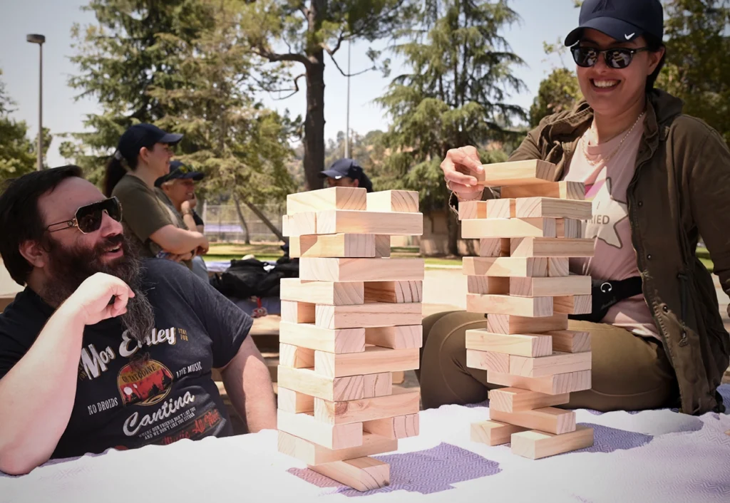Image of Virtualitics employees playing Jenga at a company picnic